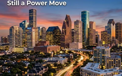Houston skyline at sunset with modern skyscrapers, showcasing urban development and the phrase "Still a Power Move," relevant to real estate trends in the Inner Loop.