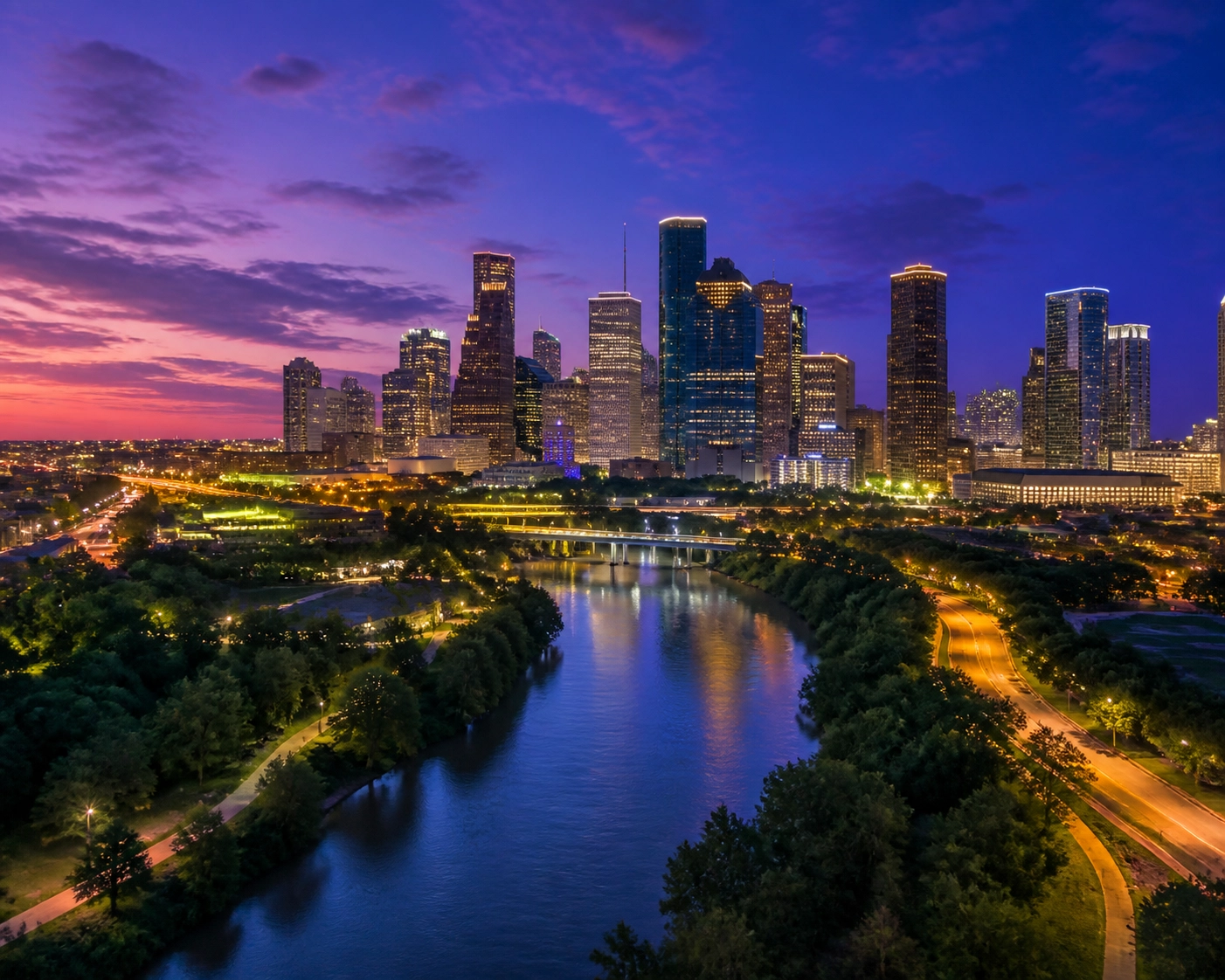 Cinematic view of the Houston skyline and Buffalo Bayou highlighting the city's energy-driven economy.