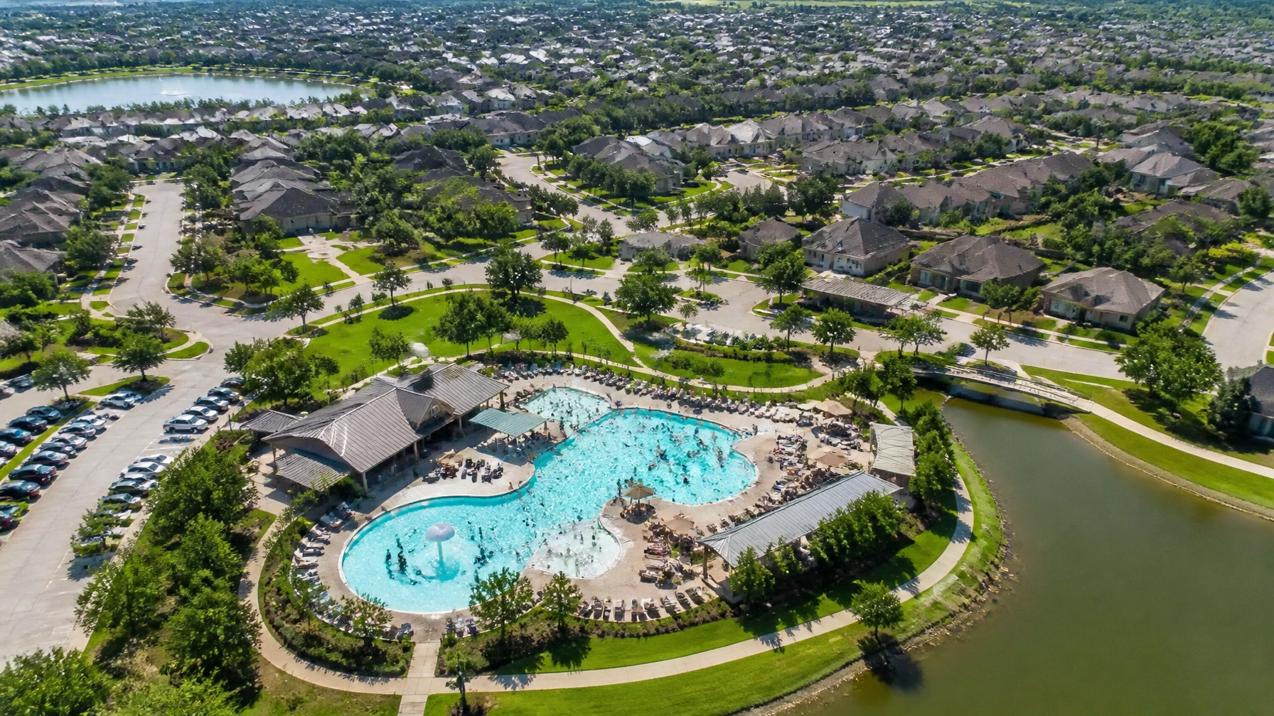 Aerial view of Houston suburban community with pool