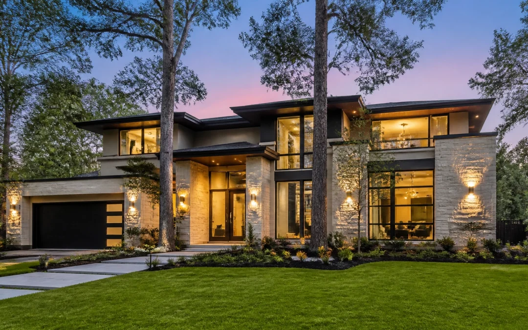 A stunning, modern luxury home in a lush, tree-lined neighborhood typical of The Woodlands or Katy, Texas.