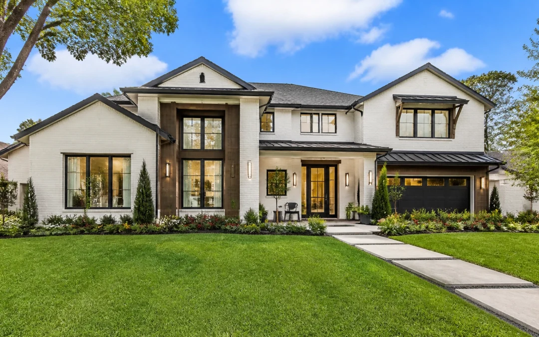Modern new construction home in Houston suburban style with white brick and wood accents