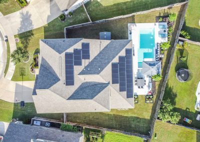 Aerial view of 26107 Pond Lily Circle property with pool and solar panels