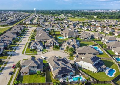 Aerial view of Richmond, TX neighborhood and homes for sale with pools
