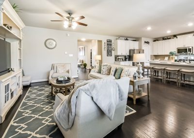Living room and kitchen area in Katy, Texas home for sale by Bexley Realty Group.