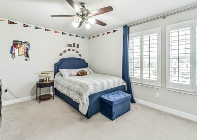 Stylish Katy Texas bedroom in featured Bexley Realty Group property listing.