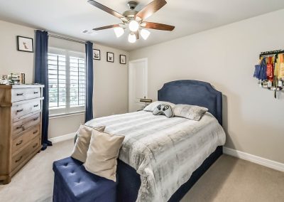 Bedroom interior showcasing property listing in Katy, Texas.