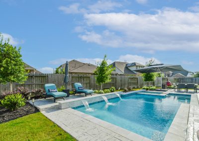 Luxury Katy Texas home with pool and outdoor lounge area