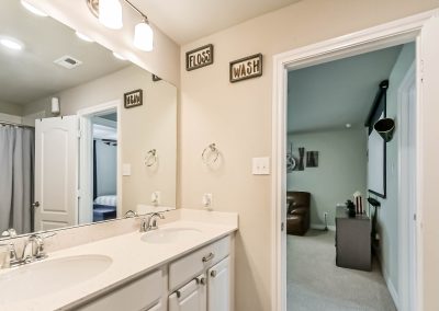 Bathroom interior with doorway to bedroom in Katy, Texas property listing.