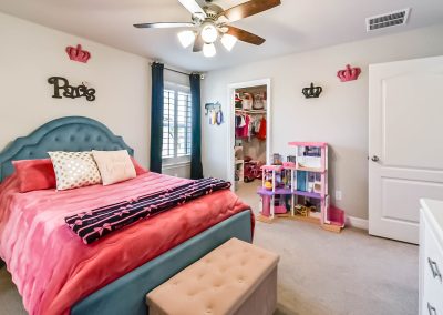 Stylish Katy Texas bedroom for sale with crown decor and walk-in closet