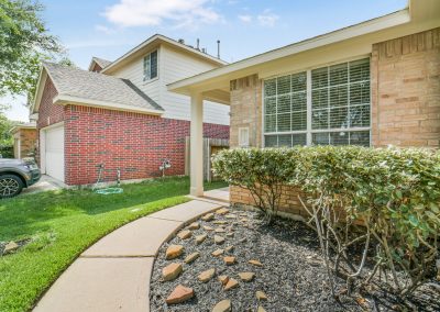 Exterior of a brick home in Richwood Oaks Drive, Katy, Texas.