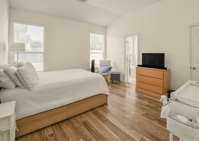 Bright bedroom interior in Katy, Texas property for sale by Bexley Realty Group.
