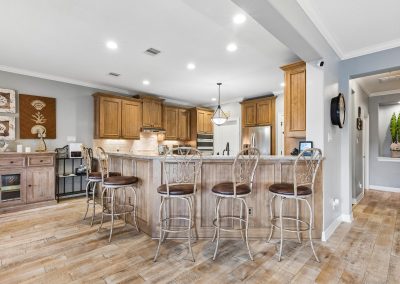 Kitchen island with bar stools in Galveston, Texas home for sale