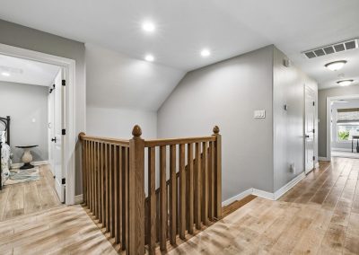 Interior hallway and staircase in Galveston, Texas home for sale by Bexley Realty Group.