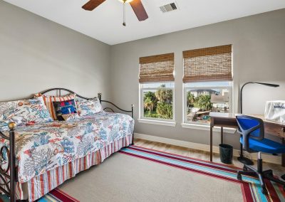 Bedroom interior with window view and desk, featured property for sale by Bexley Realty Group.