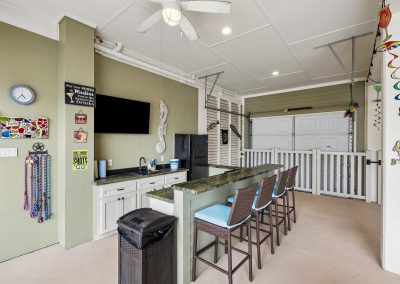 Luxury home interior with bar area and garage access in Galveston, Texas.