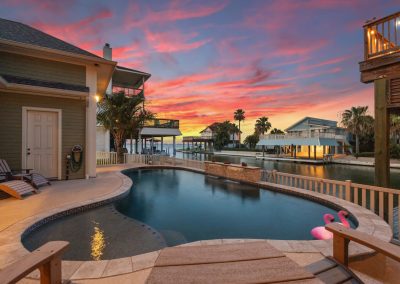 Luxury waterfront home with pool and sunset view in Galveston, Texas