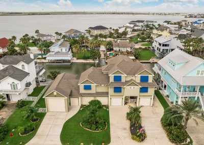 Aerial view of waterfront property in Galveston, Texas, for sale by Bexley Realty Group.