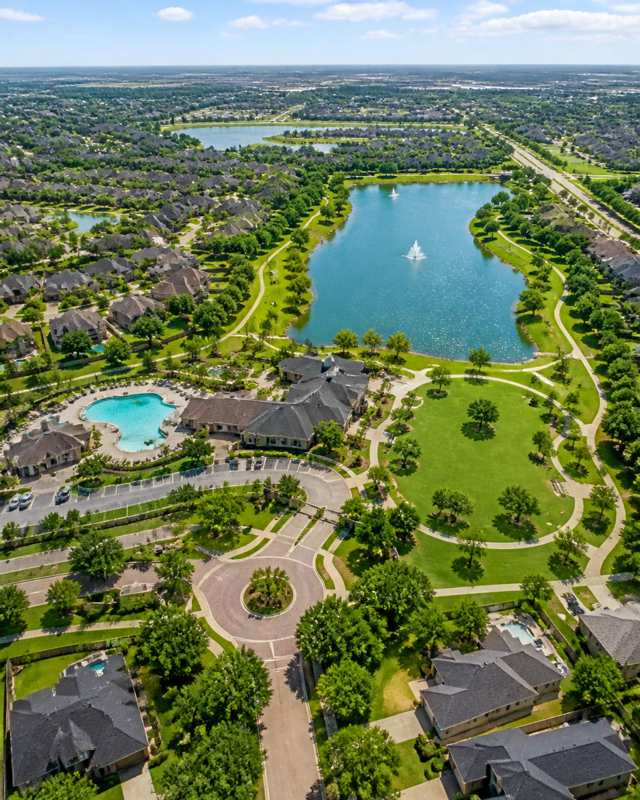 Aerial view of a lush master-planned community in Houston